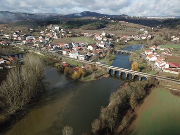 High angle view of river amidst buildings in city