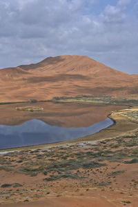 1075 lake zhalate-badain jaran desert-nomadic yurts-megadune and sky reflected. inner mongolia-china