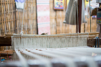 Close-up of weaving thread at industry