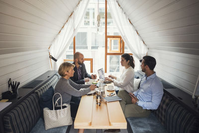 Business people having discussion at table in office