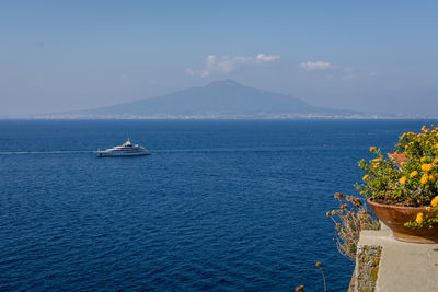 Scenic view of sea against blue sky