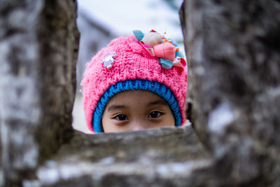 Close-up portrait of a girl in snow