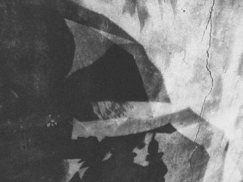 Digital composite image of person shadow on wall