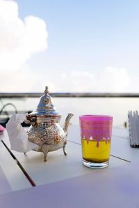 Moroccan tea with a tea cup against the clouds