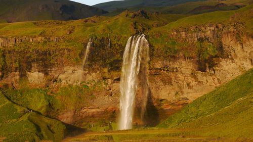 Scenic view of waterfall seljalandsfoss in evening light 