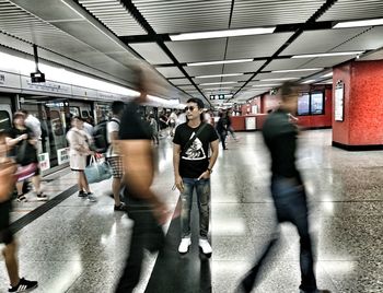 Blurred motion of man walking in bus