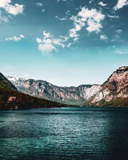 Scenic view of lake against cloudy sky