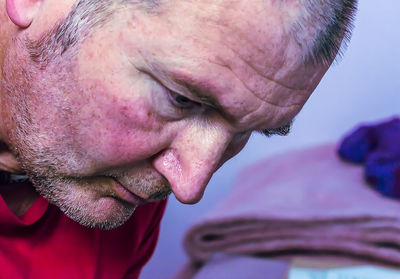 Close-up portrait of man with hands