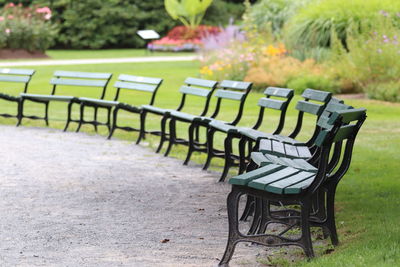 Empty chairs and table in park