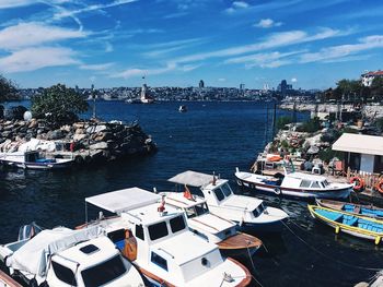 High angle view of harbor by city against sky