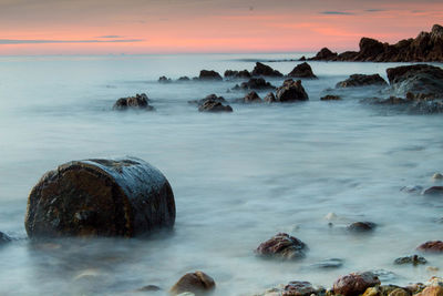 Scenic view of sea against sky during sunset