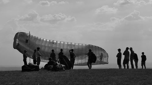 People on field against sky