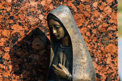 Close-up of statue against wall