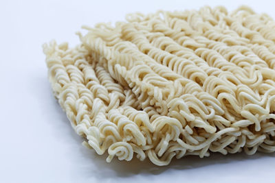 Close-up of food in plate on white background