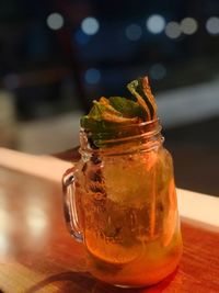 Close-up of drink in glass jar on table