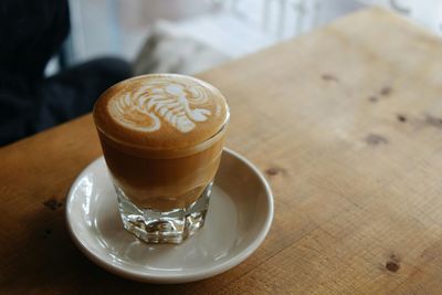 Close-up of cappuccino on table