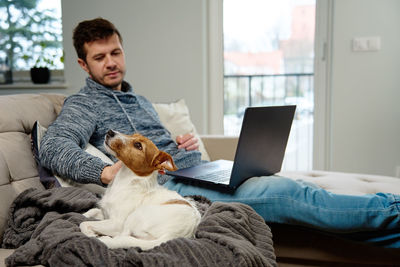 Man using laptop at living room