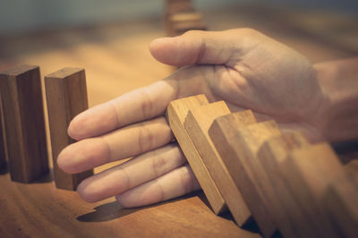 Close-up of hand holding wood