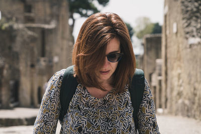 Cool woman walking on the main street of pompeii