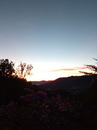 Silhouette landscape against clear sky during sunset