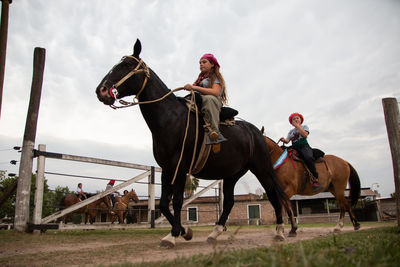 Girls riding horses