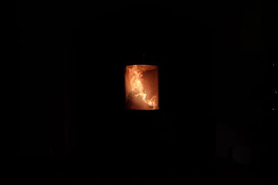 Close-up of illuminated lighting equipment at night