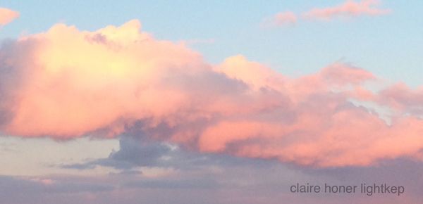 Low angle view of cloudy sky at sunset