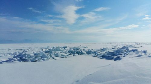 Scenic view of snow covered landscape against sky