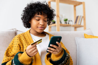 Young woman using mobile phone