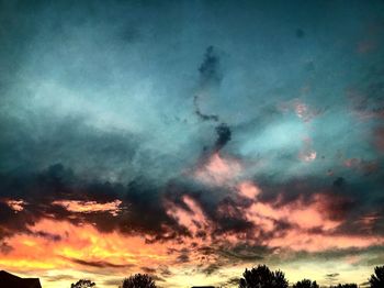 Low angle view of dramatic sky at sunset