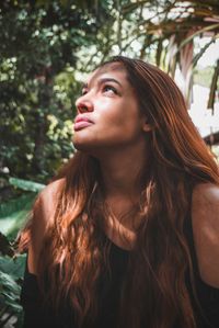 Portrait of a beautiful young woman looking away