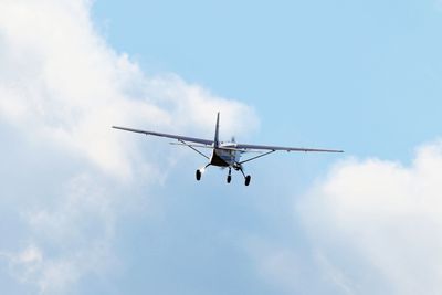 Low angle view of fighter airplane against sky