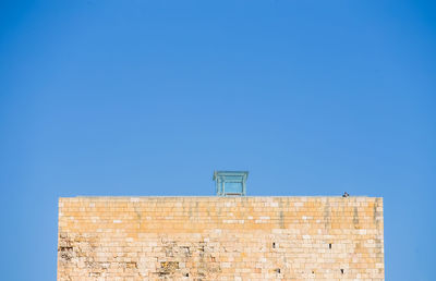 Low angle view of building against blue sky