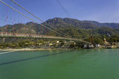 Bridge over river against sky