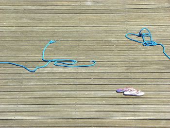 High angle view of multi colored wood on wooden floor