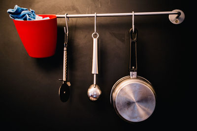 Close-up of kitchen utensils on wall