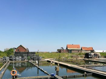 Panoramic view of buildings against clear sky