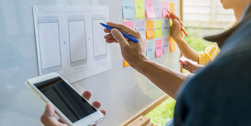 Cropped image of business colleagues working in office