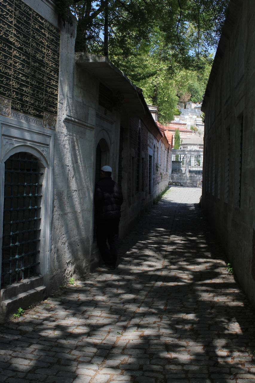 architecture, built structure, building exterior, building, direction, the way forward, arch, nature, city, entrance, no people, footpath, tree, day, plant, shadow, house, outdoors, street, sunlight, alley, long