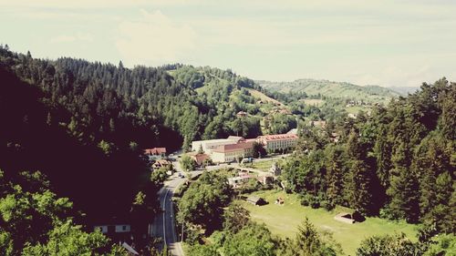 High angle view of trees and buildings against sky