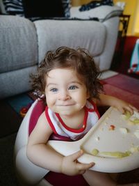 Smiling baby boy at home