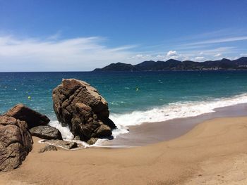 Scenic view of beach against sky