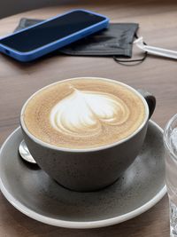 Close-up of cappuccino on table