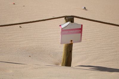 High angle view of wooden post at beach