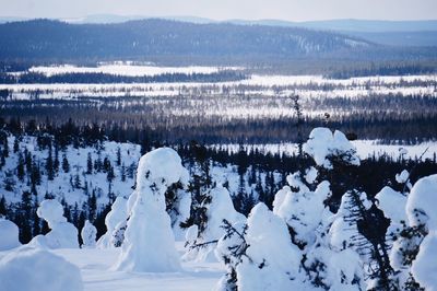 Scenic view of snow covered mountains