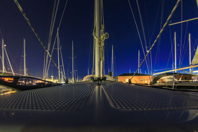 Surface level of illuminated bridge against sky at night