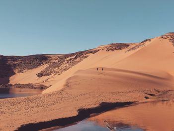 Scenic view of desert against clear sky