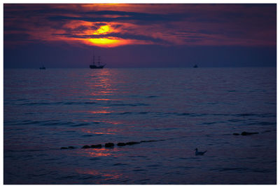 Scenic view of sea against sky at sunset