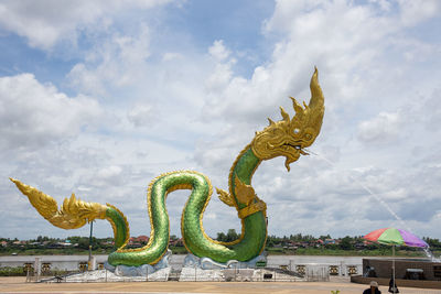 Low angle view of statue against sky