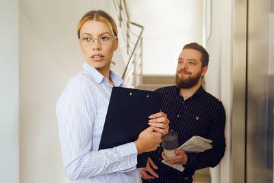 Young couple looking at camera